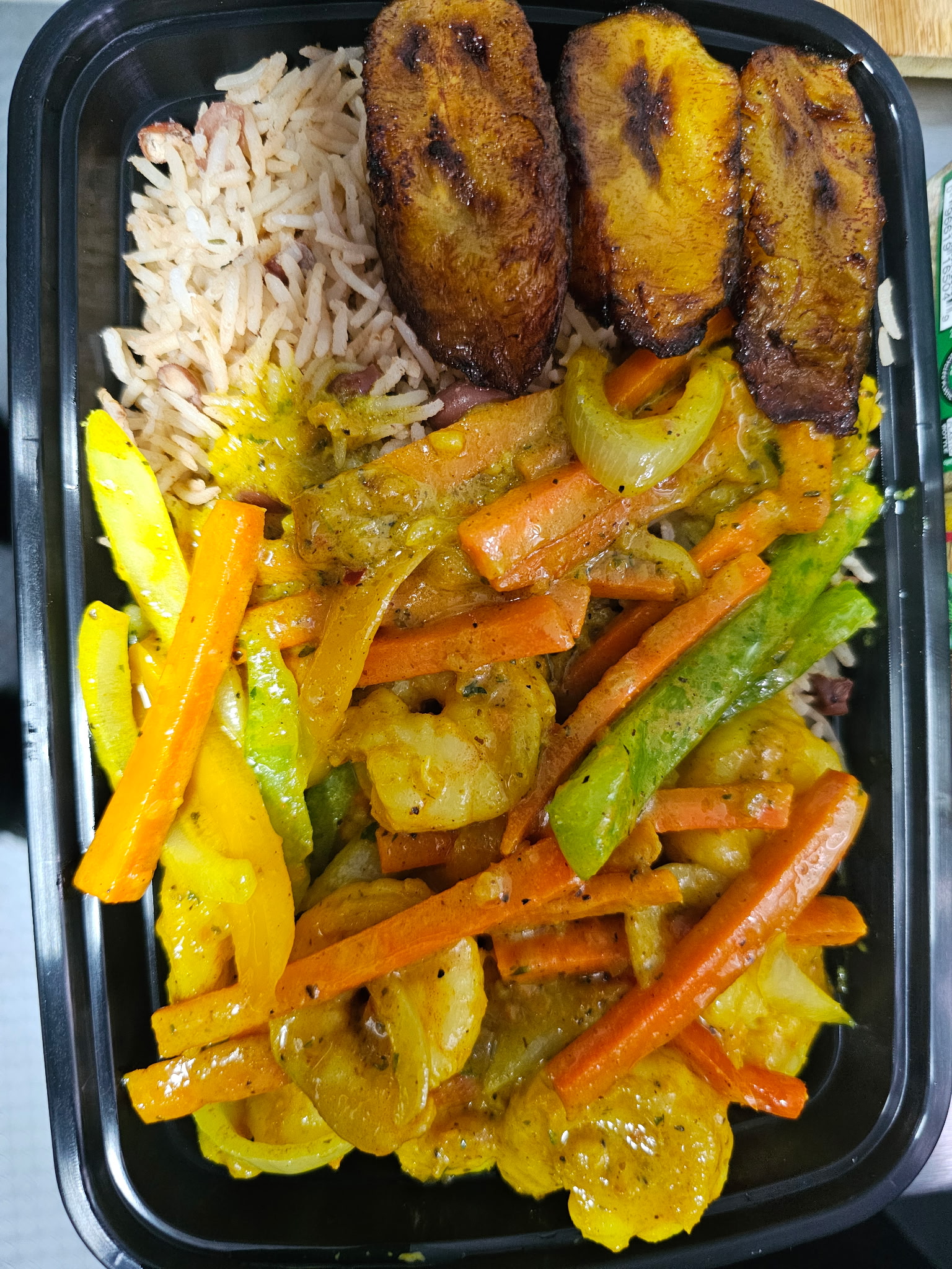 Curry Shrimp with rice and peas, and plantains